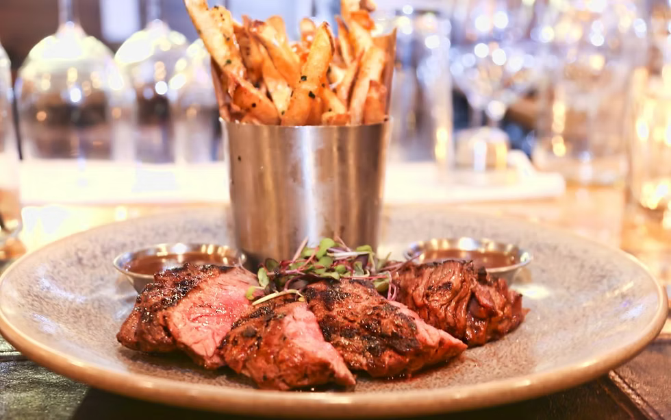 Cut steak and french fries on a plate