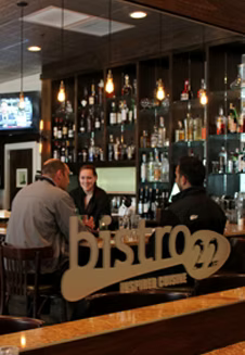 Two men dining at a bar